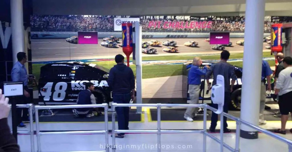 visitors practicing pit stop skills at NASCAR Hall of Fame in uptown Charlotte NC