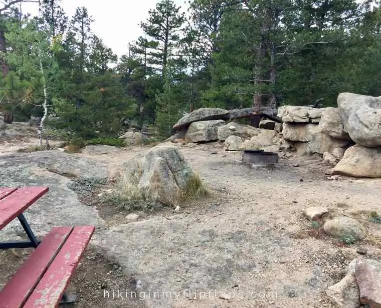 rocky campsites at hermit's hollow campground in colorado are fun for kids to climb and play