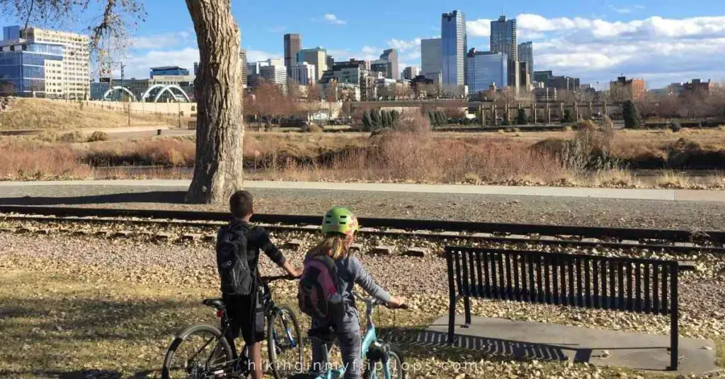 the denver skyline from the cherry creek trail