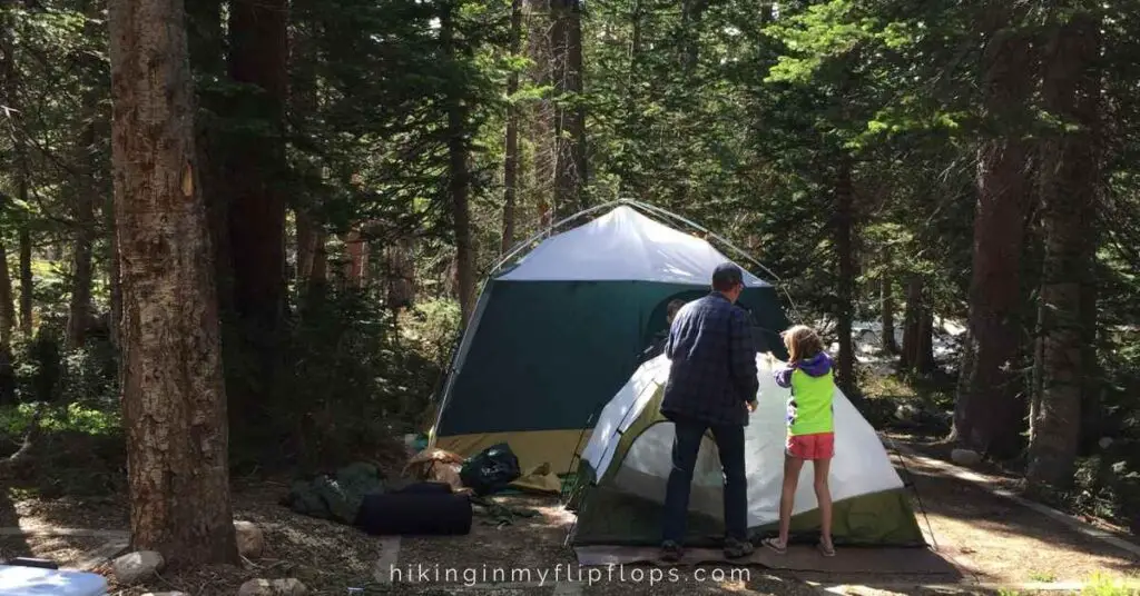 setting up the tents at a campground