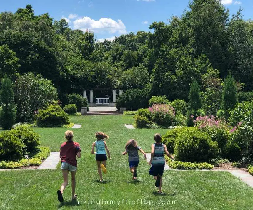kids running through the gardens at the Reynolda House, things to do in Winston-Salem