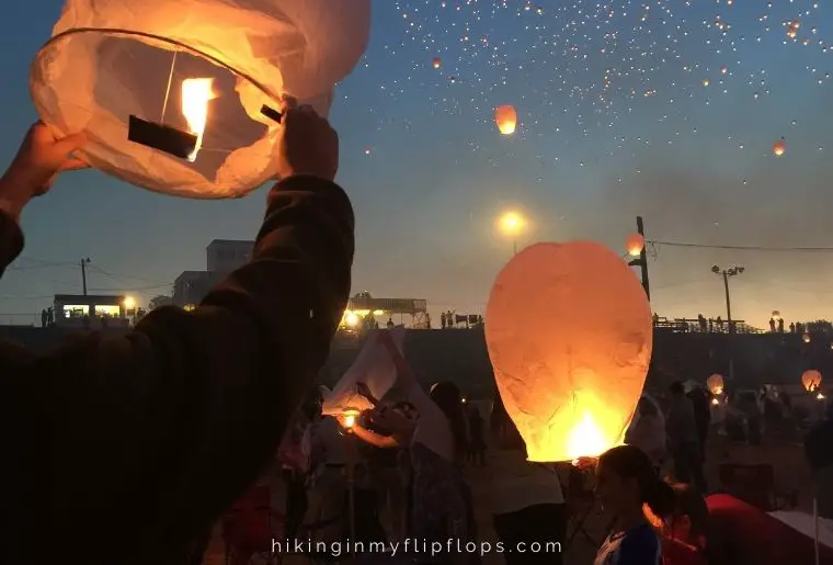 releasing paper lanterns is one of the fun things to do while camping at night