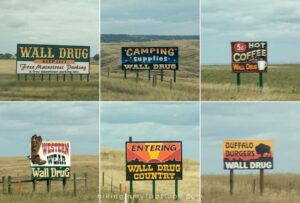 signs for wall drug along the highway in south dakota