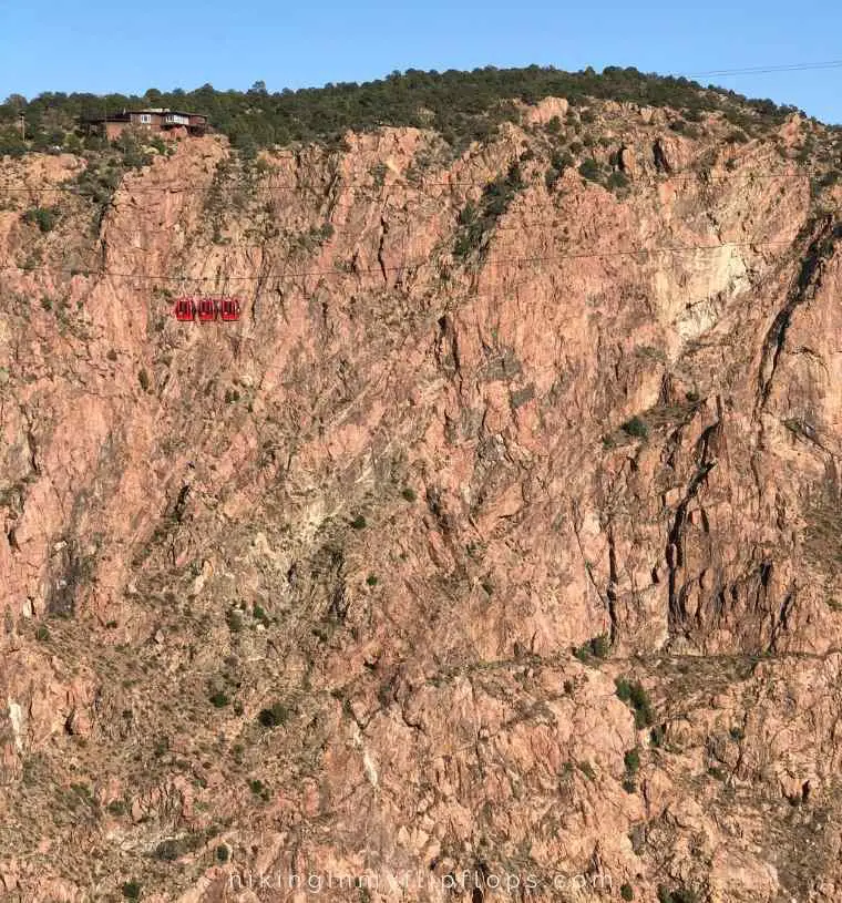 the red gondolas are shown crossing over the Royal Gorge 