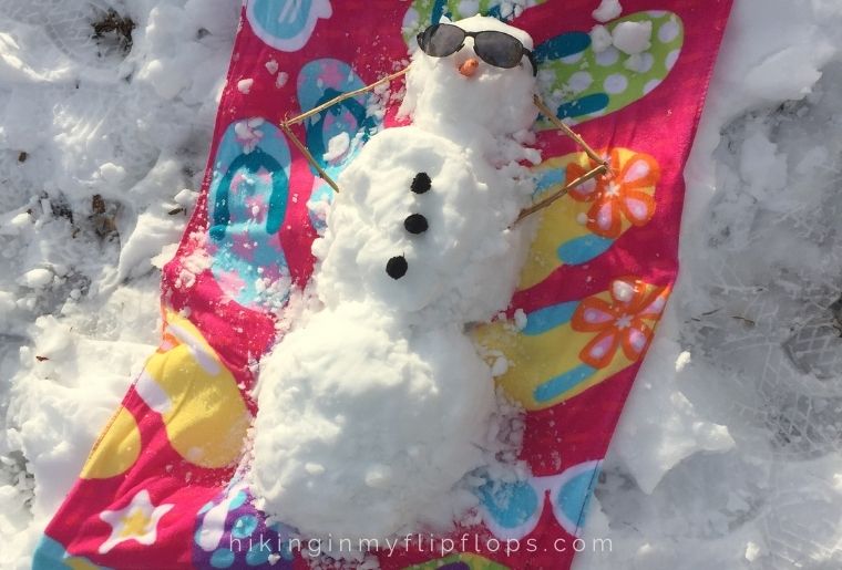snowman on a beach towel for a fun outdoor activity