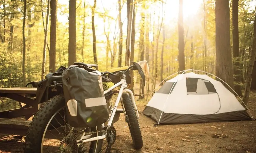 camping gear stored on a bike in a type of camping called bikepacking