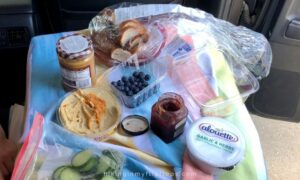 snacks laid out in a car on a road trip