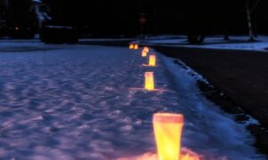 luminaries line a pathway, which are one of the easy and effective campsite lighting ideas