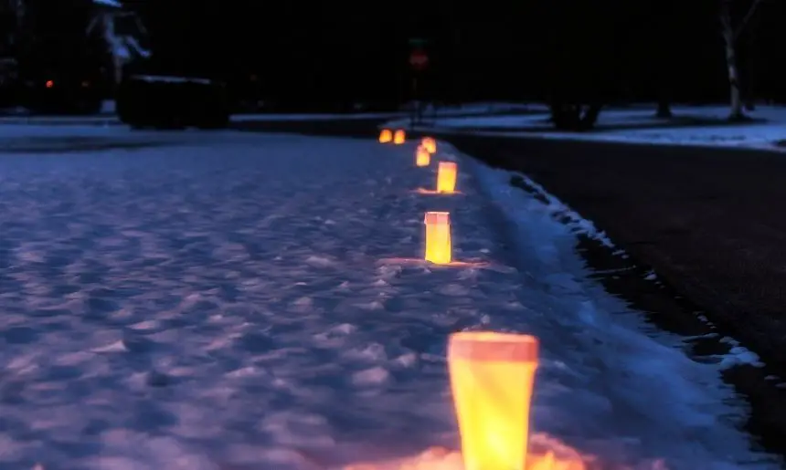 luminaries line a pathway, which are one of the easy and effective campsite lighting ideas