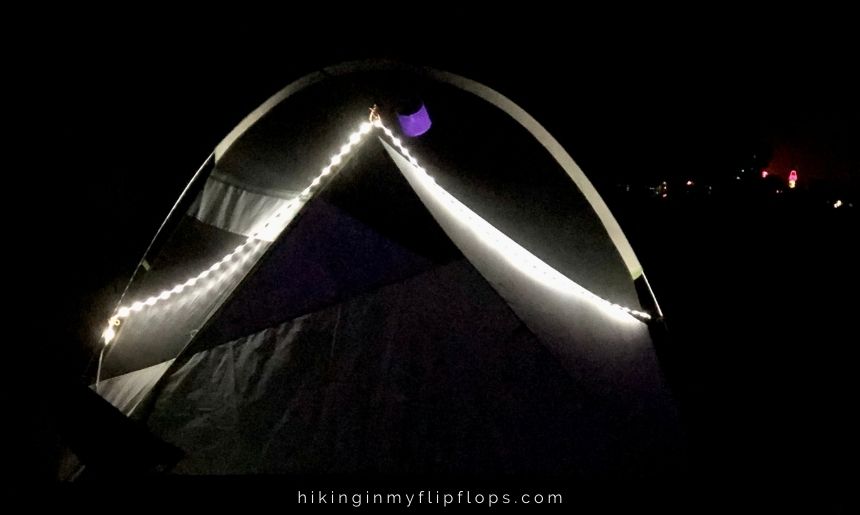 rope lights outline a tent, one of the more effective camping tent lighting ideas