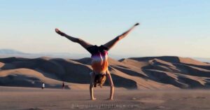 a cartwheel on top of sand dunes