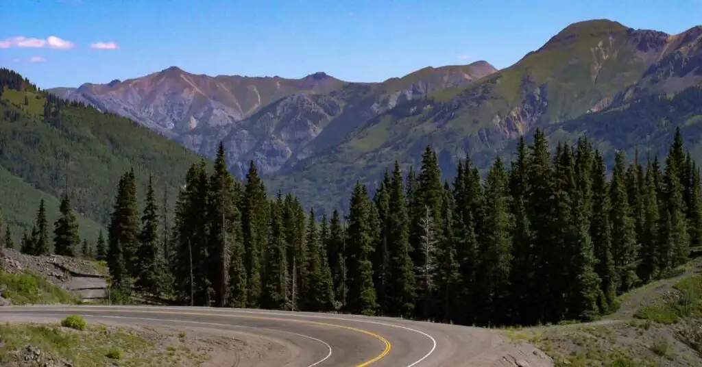 the mountains are a scenic backdrop on the Million Dollar Highway in Colorado