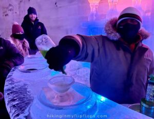 a bartender serving appletinis at an ice museum near Fairbanks AK