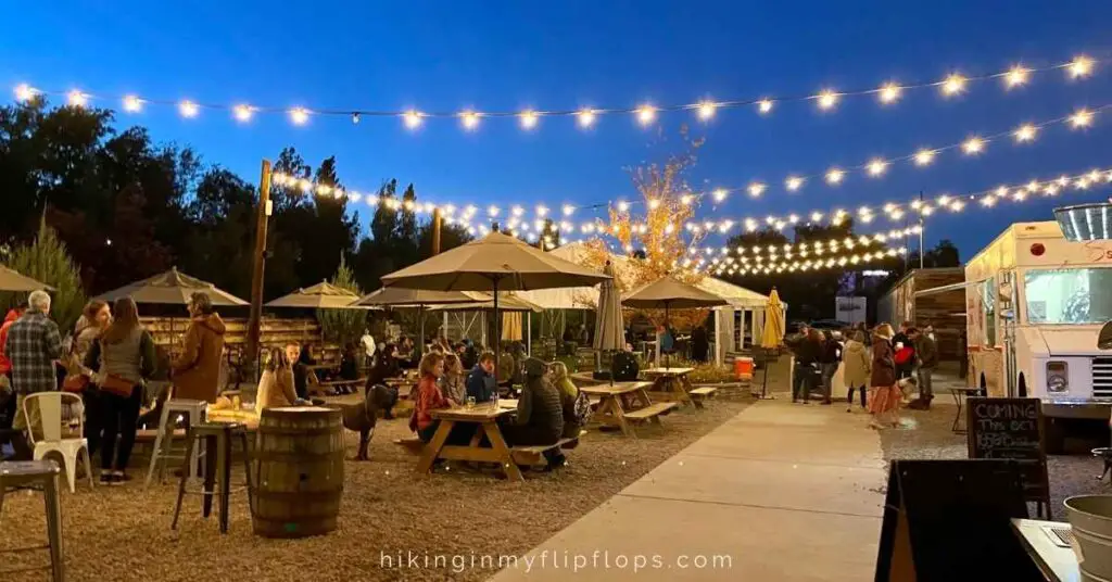 people seated in the outdoor seating area at one of the best breweries in Boulder CO