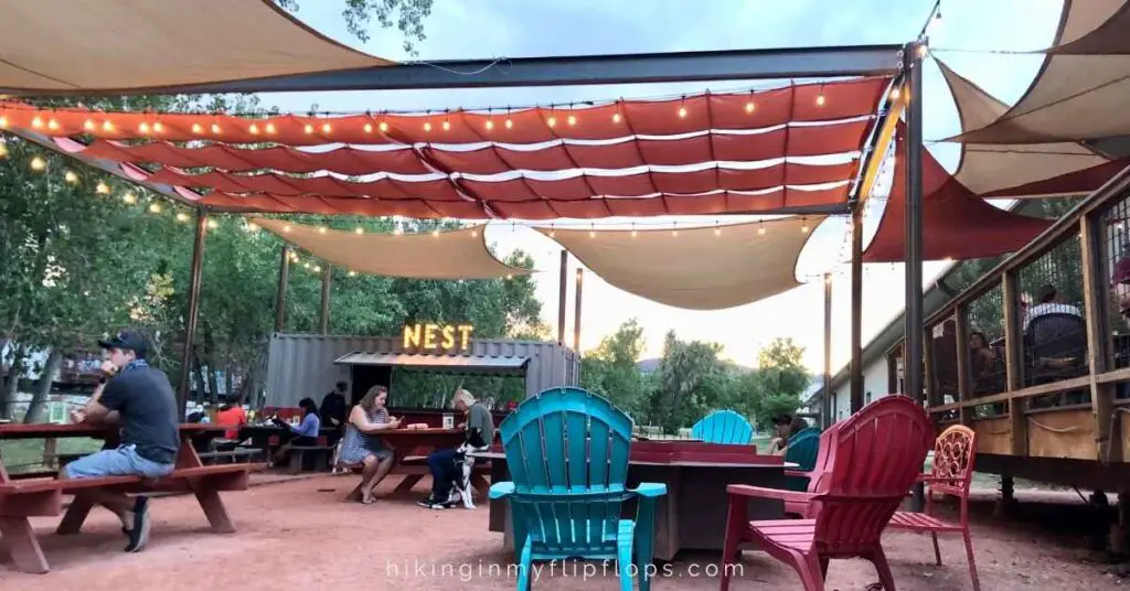 the outdoor patio with canopies to block the sun at Sanitas Brewing in Boulder CO