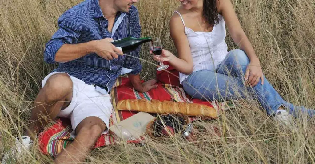 a couple with a picnic on a hiking date