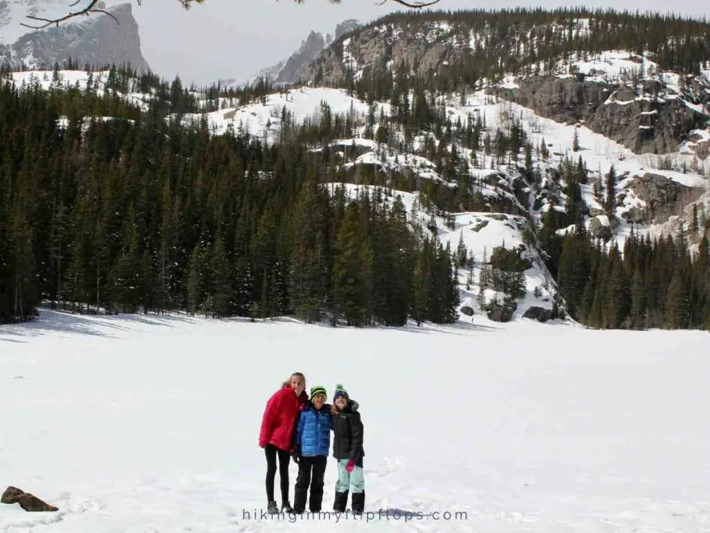 kids on the frozen Bear Lake, one of the best winter hikes in Rocky Mountain National Park