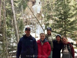 a family in front of Ouzel Falls in Rocky Mountain National Park