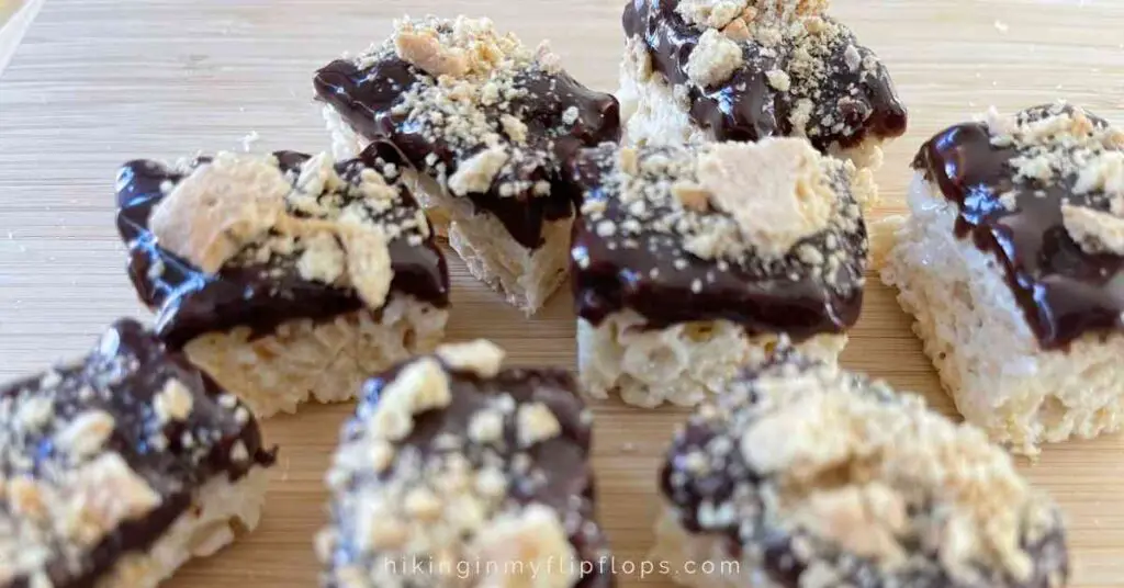 Rice Krispies Treats dipped in chocolate and graham cracker crumbs show make-ahead camping desserts