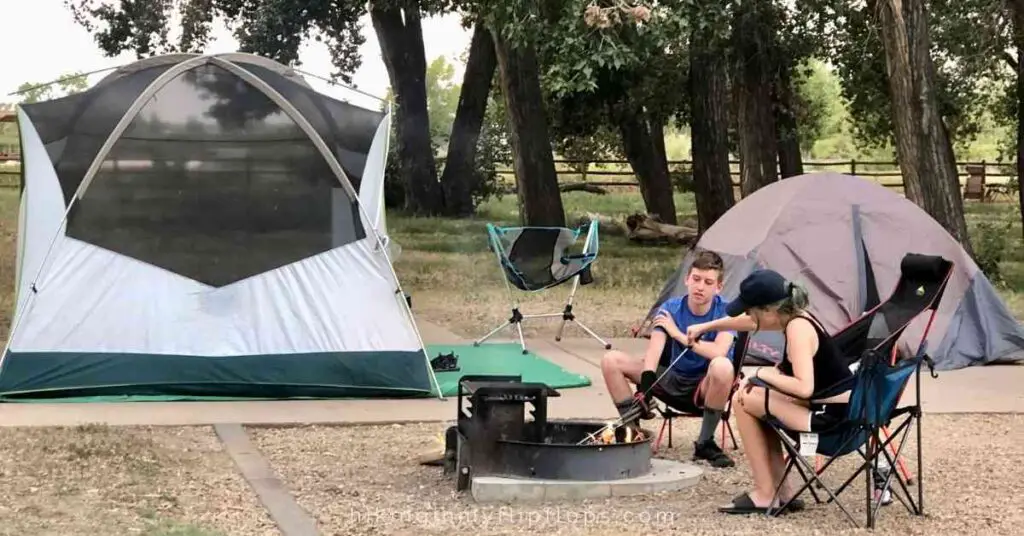 teens by a campfire at a campground