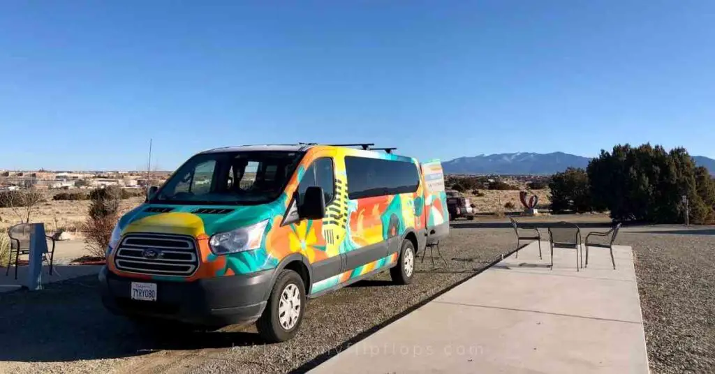 a campervan parked at an RV campground depicting tips for cooking in a campervan